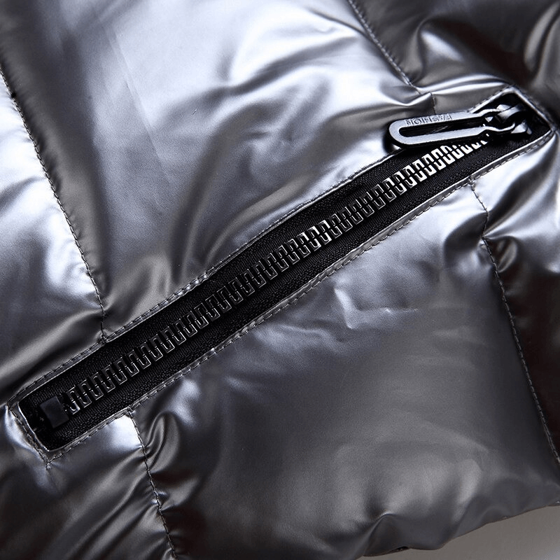 Close-up of shiny black zippered pocket on women's vest, highlighting sleek design.